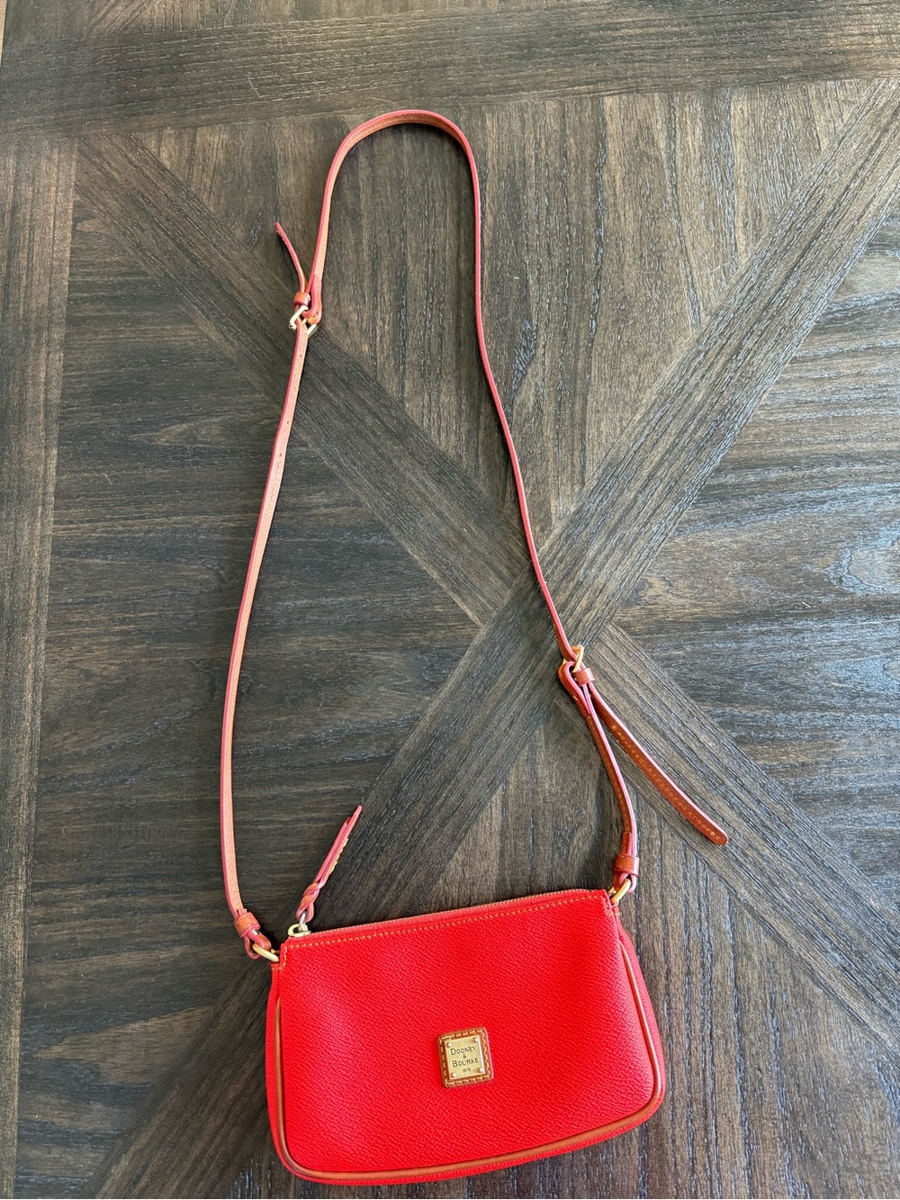 Dooney & Bourke Red Leather Crossbody with brass logo.